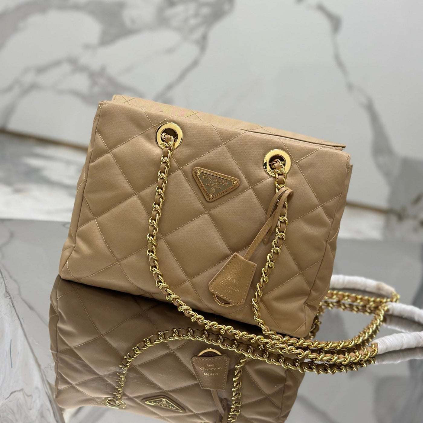 HOBO BAG 25 IN LIGHT FRENCH BEIGE QUILTED NYLON GOLD HARDWARE | Studio Nafay