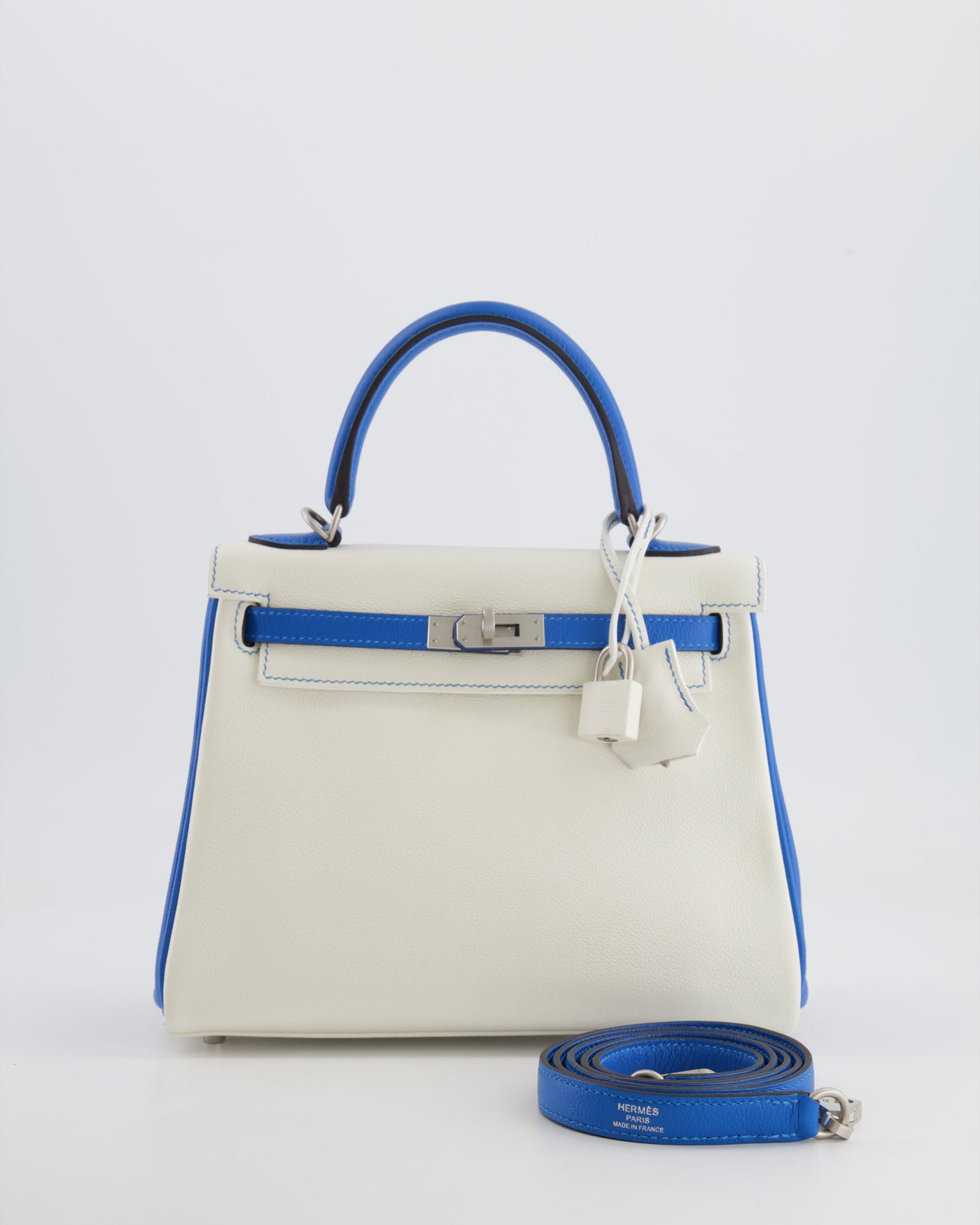 Hermes HSS Kelly 25 Retourne Bag in White and Bleu Mykonos Evercolor Leather with Contrast Stitching and Brushed Palladium Hardware | Studio Nafay