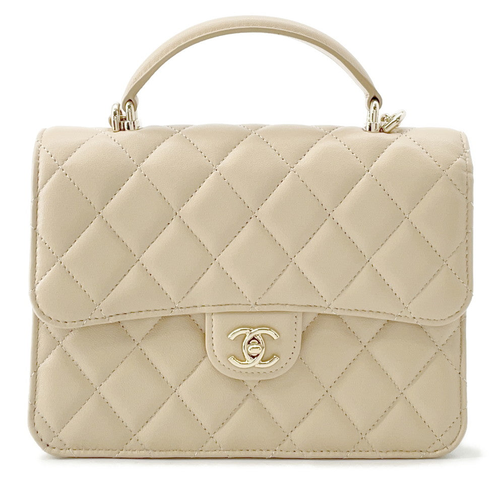 CHANEL Matelasse Top Handle Mini Chain Backpack Beige Lambskin | Studio Nafay