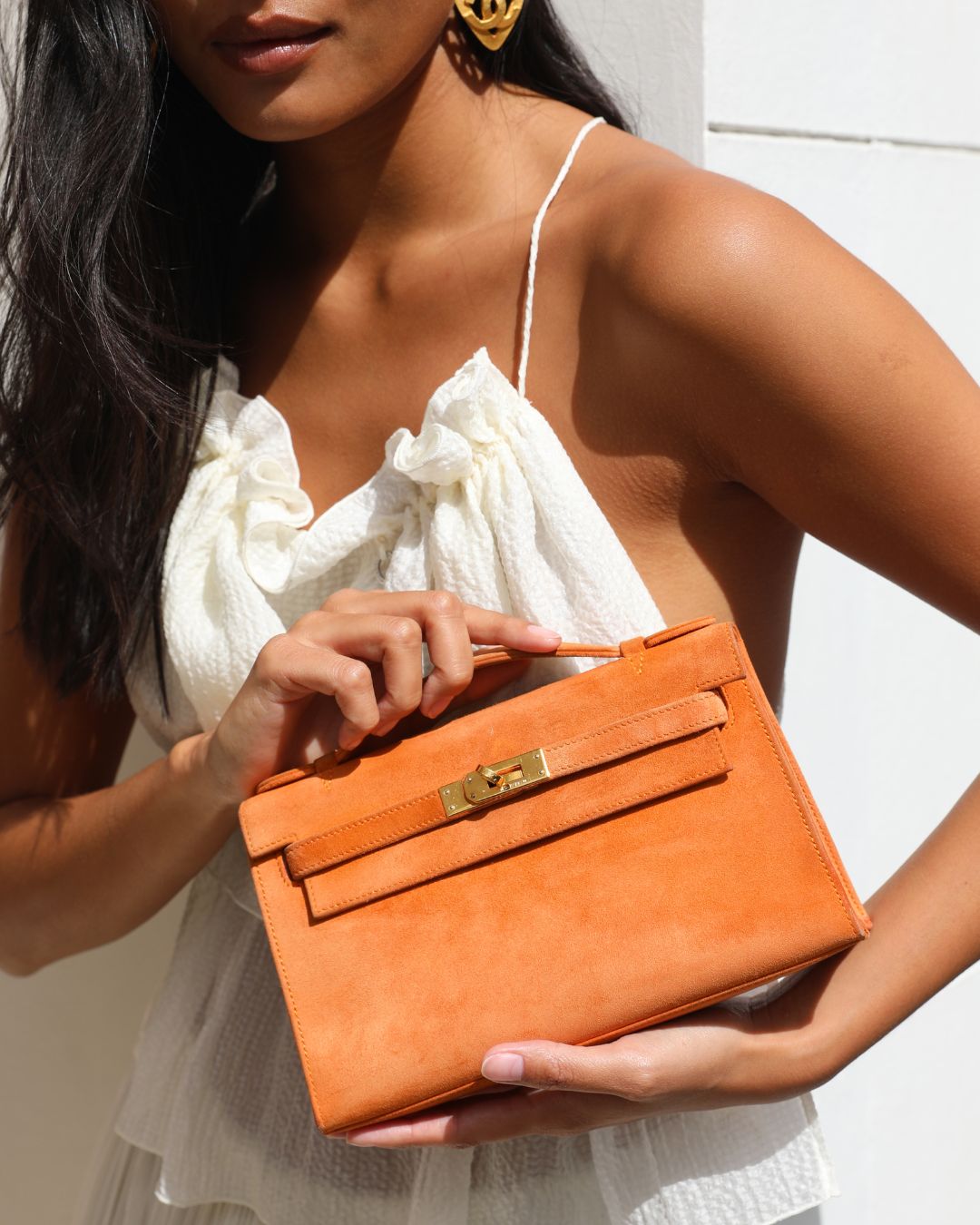 Hermes Mini Kelly Pochette Bag in Orange Veau Doblis Leather with Gold Hardware | Studio Nafay
