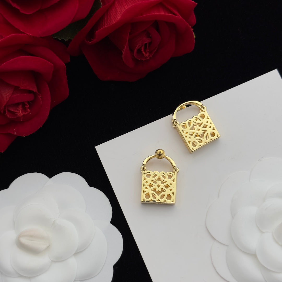 ANAGRAM BAG GOLD STUD EARRINGS | Studio Nafay